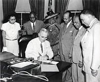 President Truman establishes Freedom Day surrounded by civil rights leaders.